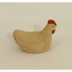 Poule beige qui couve,...