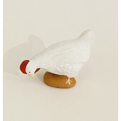 Poule blanche picorante,...
