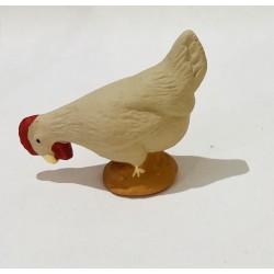 Poule beige picorante,...